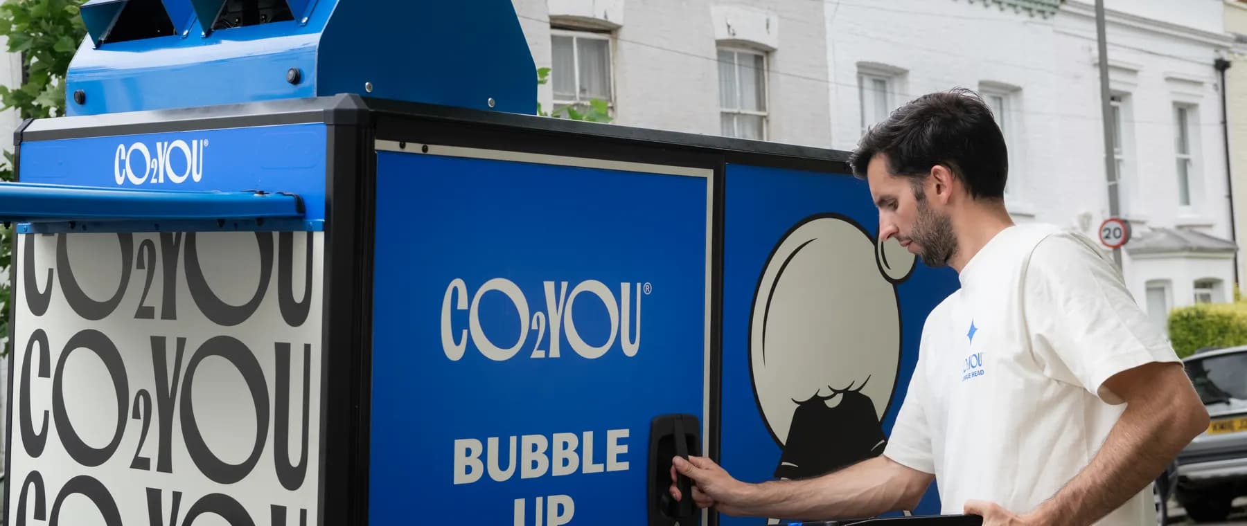A CO2 YOU rider loading the Bubble Bike on a London street